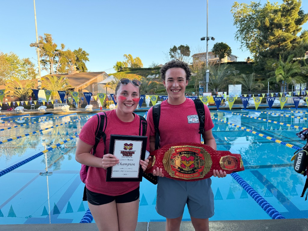 Oliver Winter — Co-Founder, swimmer holding championship belt